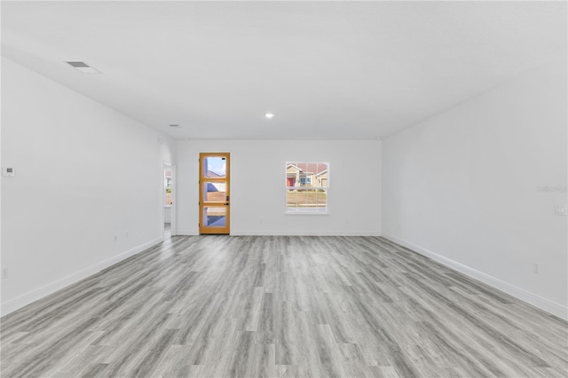 unfurnished room featuring light hardwood / wood-style floors