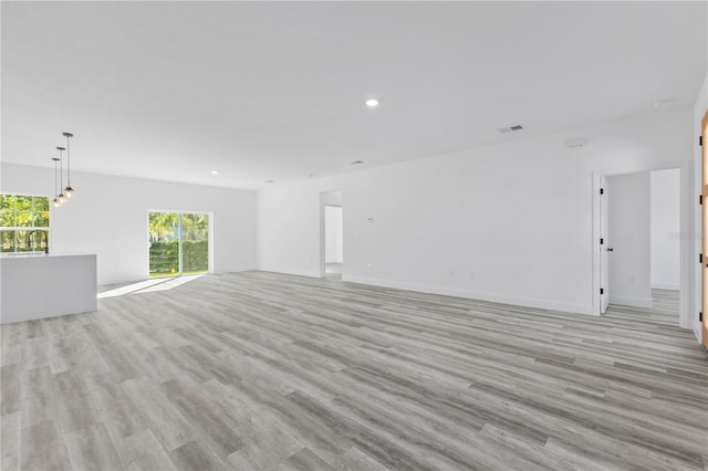 unfurnished room featuring sink and light wood-type flooring