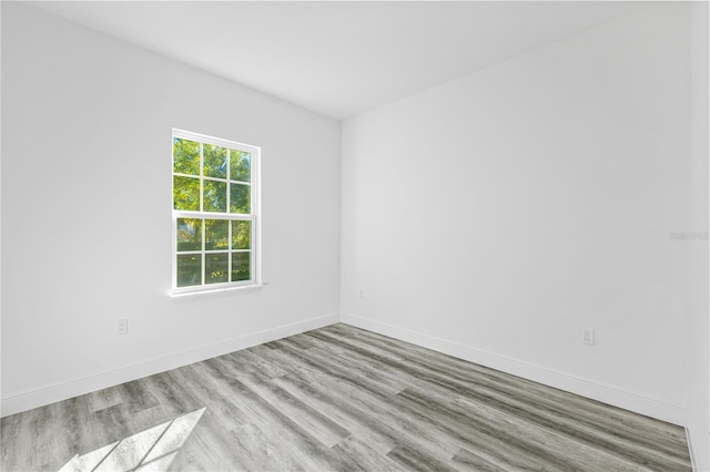 empty room with light hardwood / wood-style floors