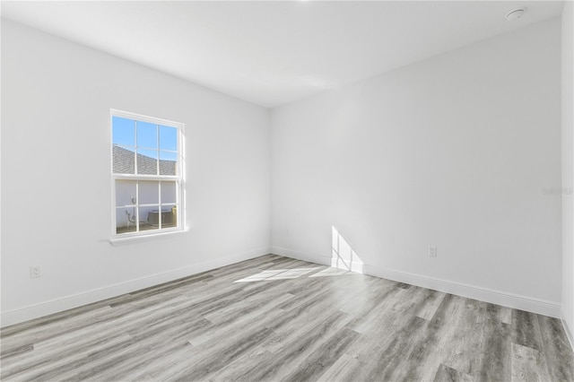 unfurnished room featuring light hardwood / wood-style floors