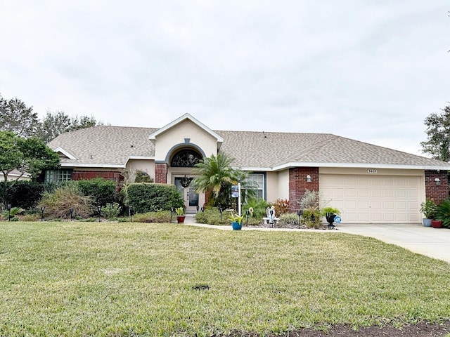 ranch-style home with a garage and a front lawn