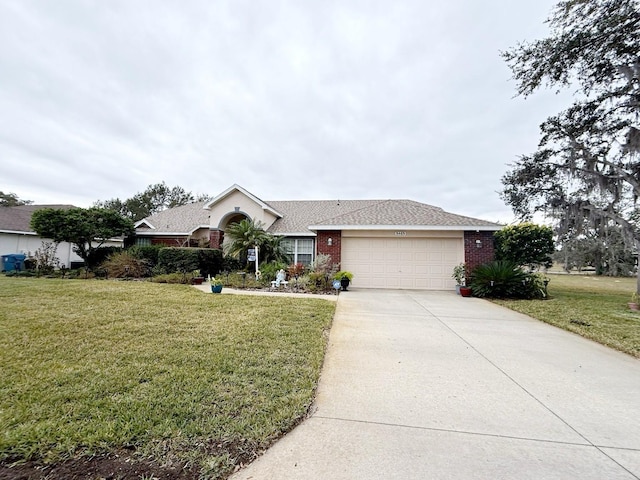 ranch-style house with a garage and a front lawn