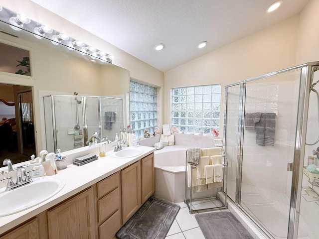 bathroom featuring vanity, independent shower and bath, and tile patterned flooring