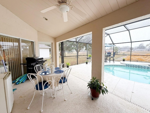 view of patio featuring a lanai and grilling area