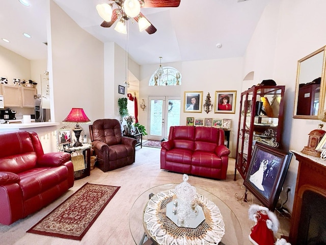 living room with vaulted ceiling, light colored carpet, ceiling fan, and french doors