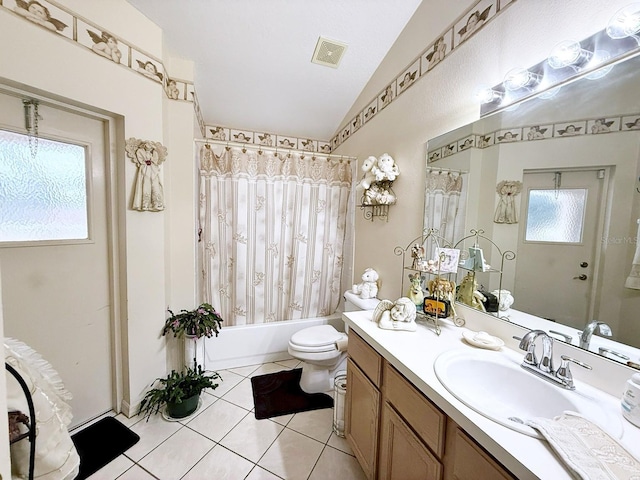 full bathroom featuring shower / tub combo with curtain, lofted ceiling, vanity, toilet, and tile patterned floors