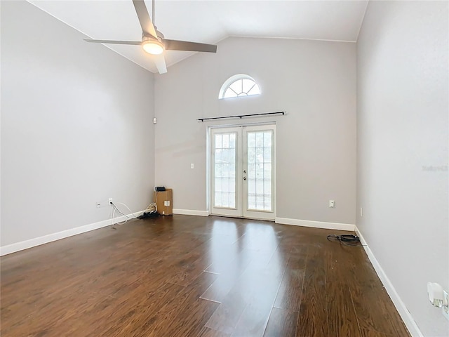 unfurnished room featuring french doors, ceiling fan, lofted ceiling, and dark wood-type flooring