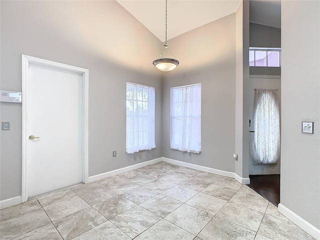 entryway featuring vaulted ceiling