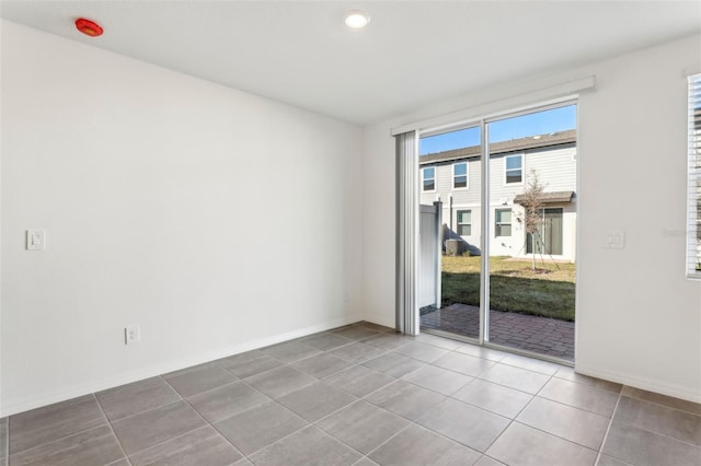 spare room with tile patterned floors