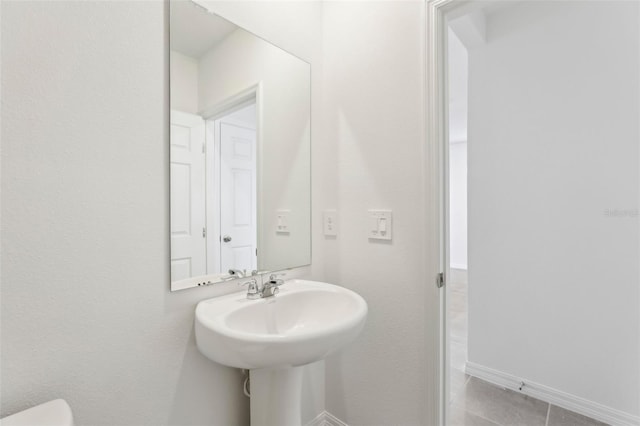 bathroom featuring tile patterned flooring