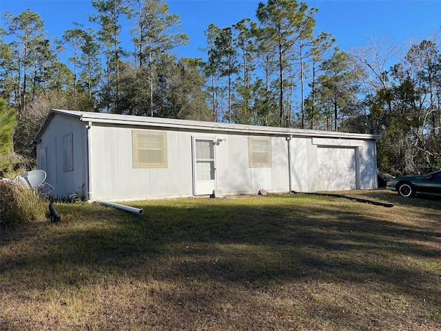 view of outbuilding with a yard