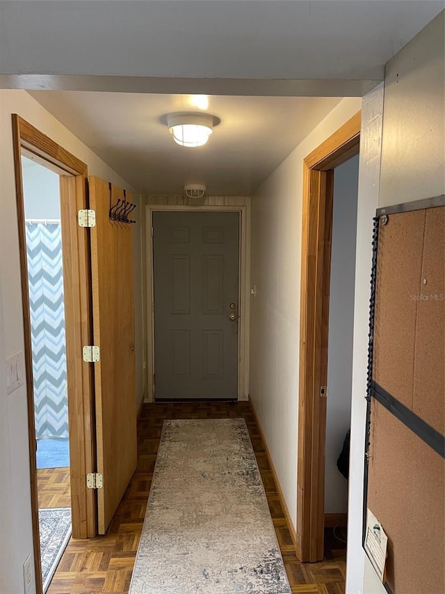 hallway featuring dark parquet floors