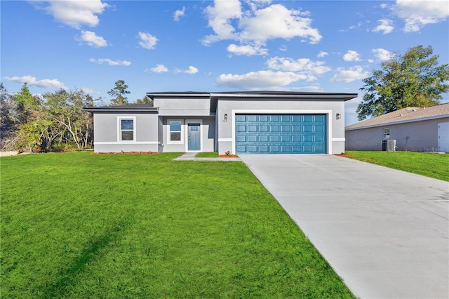 view of front of home with cooling unit, a garage, and a front lawn