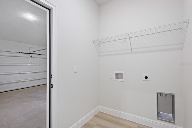 laundry room featuring hardwood / wood-style floors, washer hookup, and hookup for an electric dryer