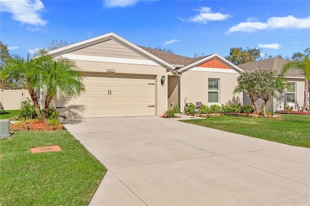 ranch-style house featuring a garage and a front yard