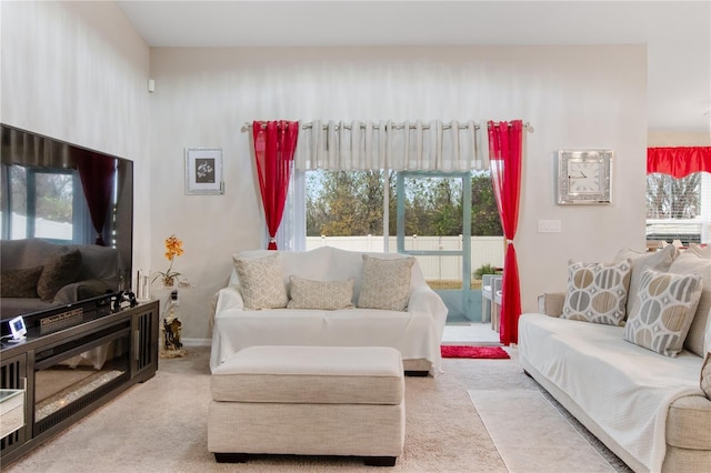 living room featuring light carpet