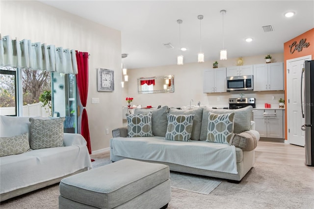 living room with light hardwood / wood-style floors