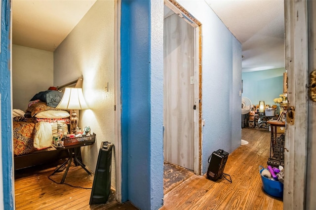 corridor featuring hardwood / wood-style flooring