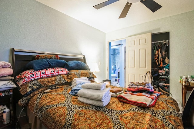 bedroom featuring ceiling fan, connected bathroom, and a closet