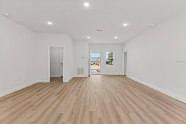 unfurnished room featuring light wood-type flooring