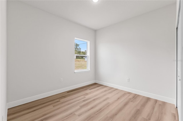 unfurnished room featuring light hardwood / wood-style flooring