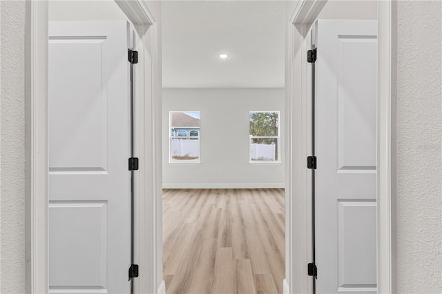 hallway featuring light wood-type flooring