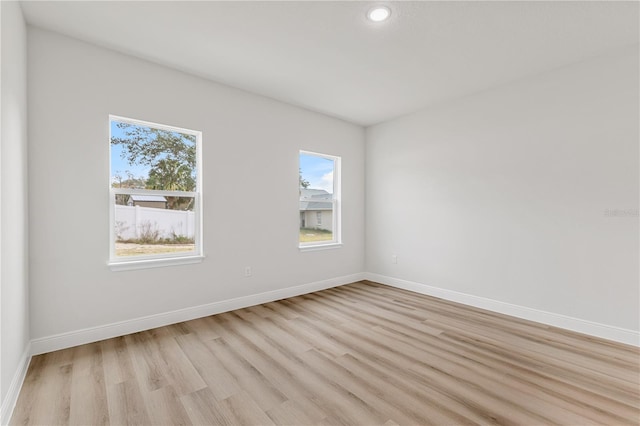 spare room with light wood-type flooring