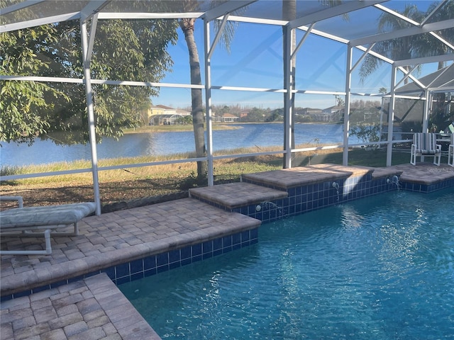 view of pool with a patio, a water view, and glass enclosure