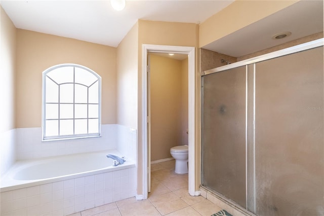 bathroom featuring tile patterned floors, shower with separate bathtub, and toilet