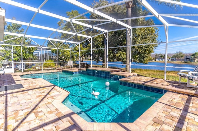 view of swimming pool with a patio area, a water view, pool water feature, and glass enclosure