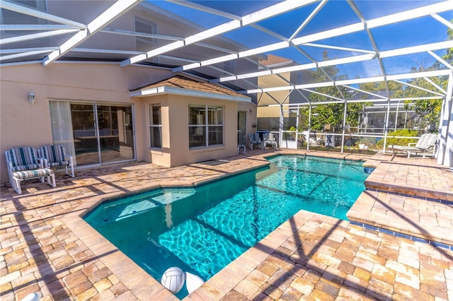 view of pool with a lanai and a patio