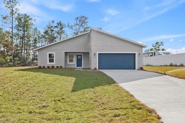 view of front facade with a garage and a front yard