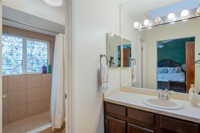 bathroom with vanity and a shower with curtain