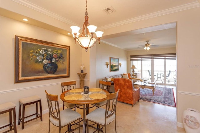 dining room with ceiling fan with notable chandelier and ornamental molding