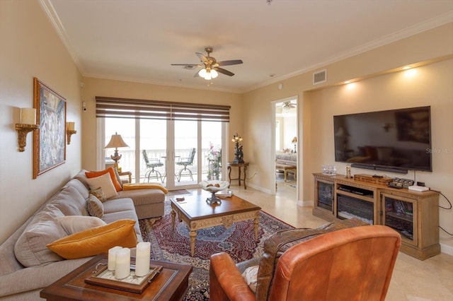 living room with ornamental molding, french doors, and ceiling fan