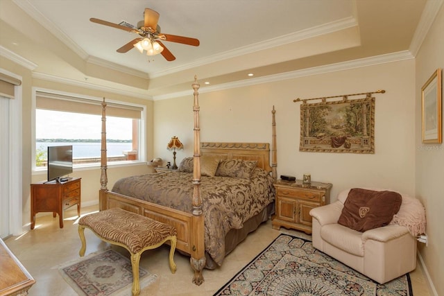 bedroom featuring ornamental molding, a raised ceiling, and ceiling fan