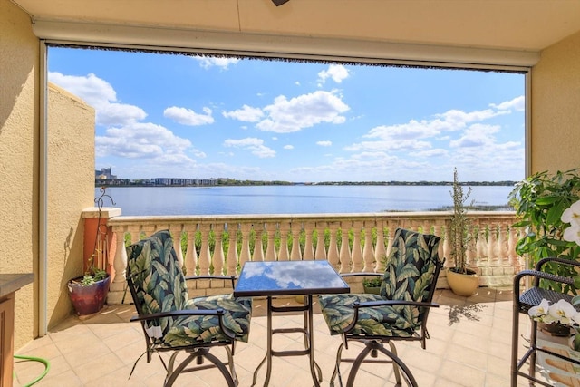 balcony featuring a water view