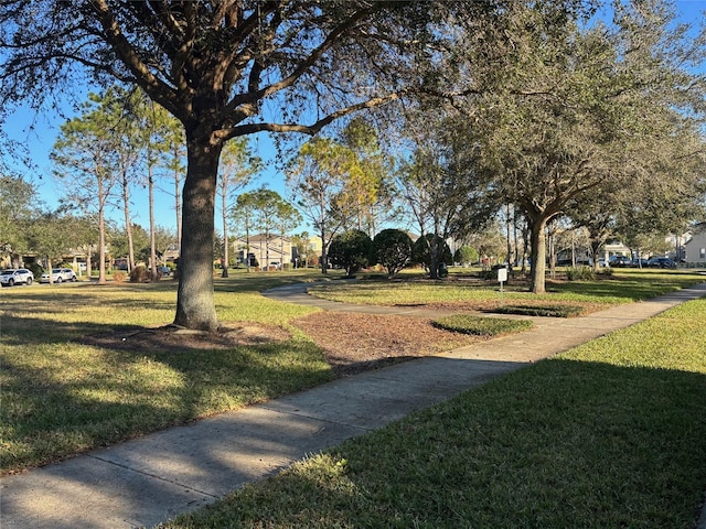 surrounding community featuring a lawn