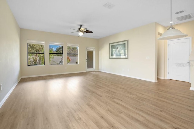 unfurnished living room featuring ceiling fan and light wood-type flooring