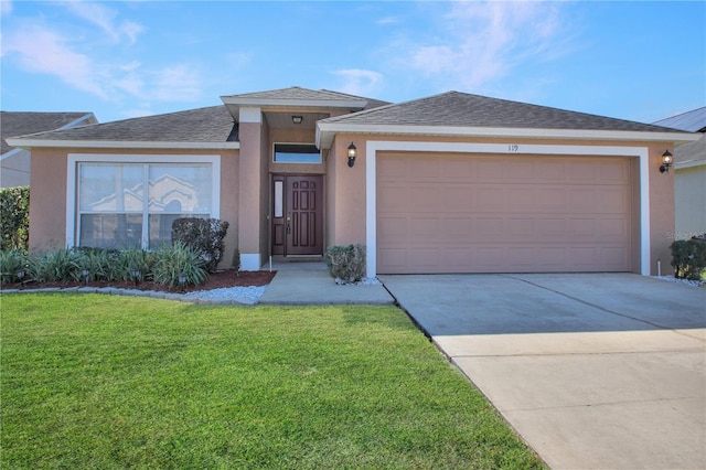 view of front of home with a garage and a front yard