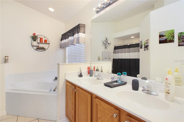 bathroom featuring tile patterned flooring, vanity, and separate shower and tub