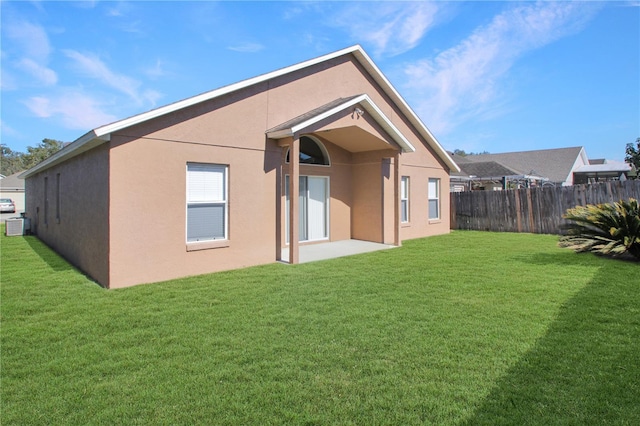 back of house with a yard