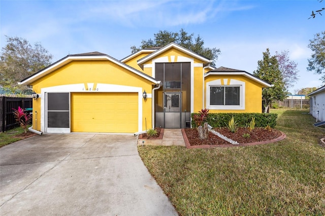 view of front of home featuring a garage and a front yard