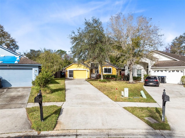 view of front of property featuring a garage and a front lawn