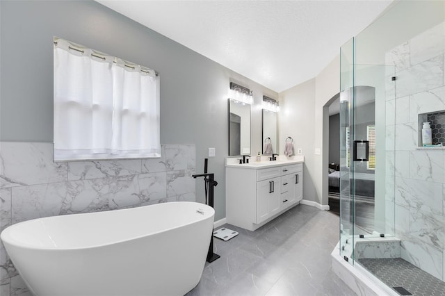 bathroom with vanity and plus walk in shower