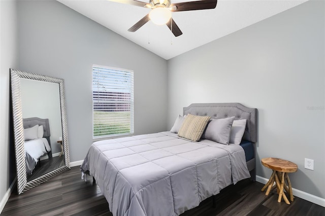 bedroom with ceiling fan, dark hardwood / wood-style floors, and vaulted ceiling