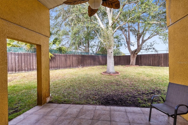 view of yard with a patio and ceiling fan