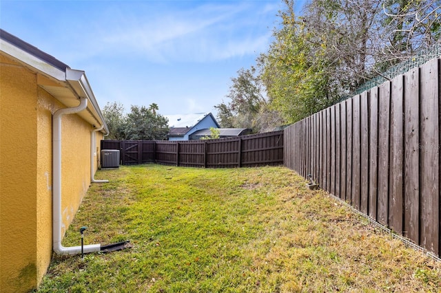 view of yard with central AC