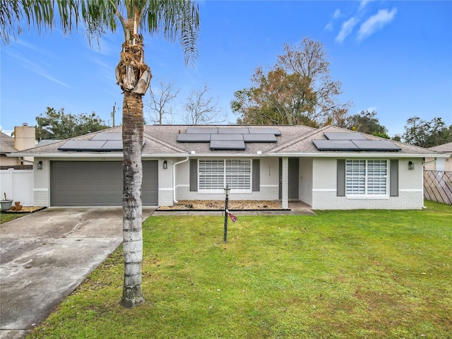 ranch-style home with a garage and a front yard