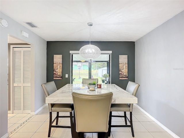 dining area featuring light tile patterned flooring